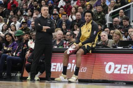 Mar 1, 2024; Toronto, Ontario, CAN; Toronto Raptors head coach Darko Rajakovic and forward Scottie Barnes (4) wait for a stoppage in play against the Golden State Warriors during the first half at Scotiabank Arena. Mandatory Credit: John E. Sokolowski-USA TODAY Sports