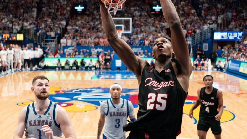 Feb 3, 2024; Lawrence, Kansas, USA; Houston Cougars forward Joseph Tugler (25) dunks the ball against the Kansas Jayhawks during the second half at Allen Fieldhouse. Mandatory Credit: Jay Biggerstaff-USA TODAY Sports