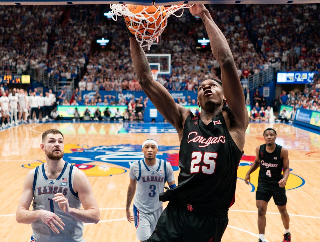 Feb 3, 2024; Lawrence, Kansas, USA; Houston Cougars forward Joseph Tugler (25) dunks the ball against the Kansas Jayhawks during the second half at Allen Fieldhouse. Mandatory Credit: Jay Biggerstaff-USA TODAY Sports