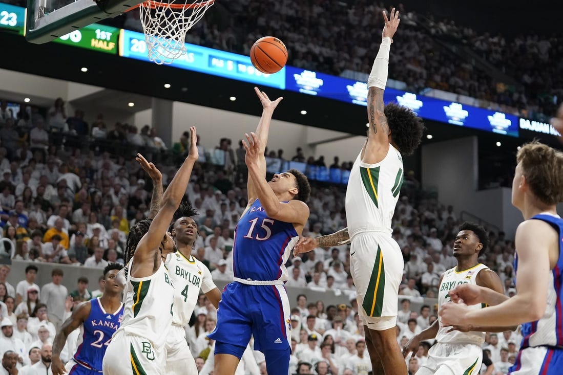 Mar 2, 2024; Waco, Texas, USA; Kansas Jayhawks guard Kevin McCullar Jr. (15) shoots over Baylor Bears guard Jayden Nunn (2) during the first half at Paul and Alejandra Foster Pavilion. Mandatory Credit: Raymond Carlin III-USA TODAY Sports