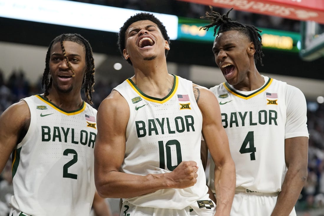 Mar 2, 2024; Waco, Texas, USA; Baylor Bears guard RayJ Dennis (10), guard Jayden Nunn (2), and guard Ja'Kobe Walter (4) react after a made basket and foul against the Kansas Jayhawks during the second half at Paul and Alejandra Foster Pavilion. Mandatory Credit: Raymond Carlin III-USA TODAY Sports