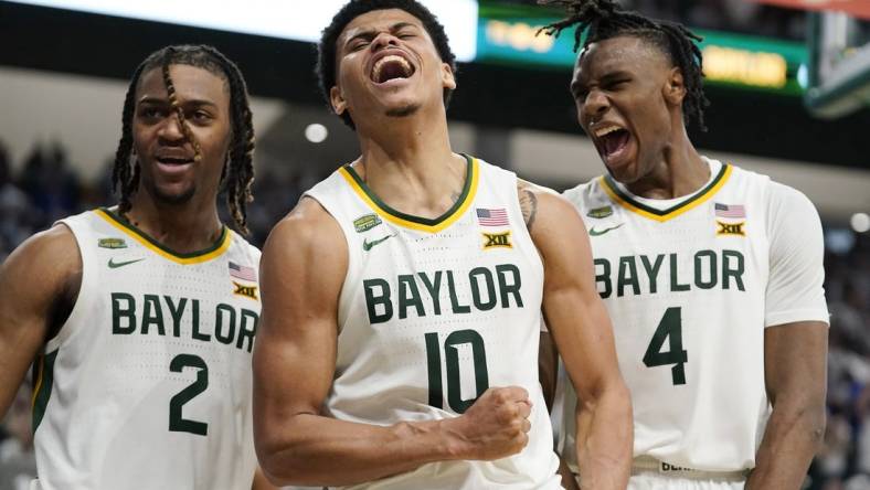 Mar 2, 2024; Waco, Texas, USA; Baylor Bears guard RayJ Dennis (10), guard Jayden Nunn (2), and guard Ja'Kobe Walter (4) react after a made basket and foul against the Kansas Jayhawks during the second half at Paul and Alejandra Foster Pavilion. Mandatory Credit: Raymond Carlin III-USA TODAY Sports