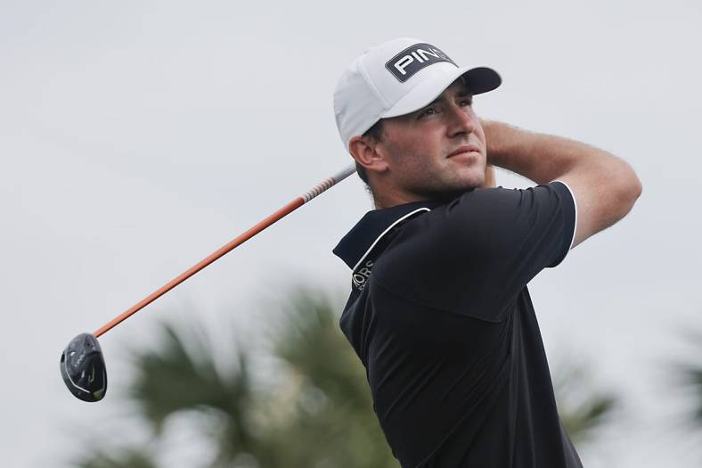 Mar 2, 2024; Palm Beach Gardens, Florida, USA; Austin Eckroat plays his shot from the fourth tee during the third round of the Cognizant Classic in The Palm Beaches golf tournament. Mandatory Credit: Reinhold Matay-USA TODAY Sports