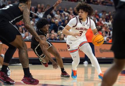 Auburn Tigers guard Tre Donaldson (3) drives the ball as Auburn Tigers take on Mississippi State Bulldogs at Neville Arena in Auburn, Ala., on Saturday, March 2, 2024. Auburn Tigers lead Mississippi State Bulldogs 39-22 at halftime.