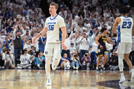 Mar 2, 2024; Omaha, Nebraska, USA; Creighton Bluejays guard Baylor Scheierman (55) celebrates a three point basket against the Marquette Golden Eagles in the second half at CHI Health Center Omaha. Mandatory Credit: Steven Branscombe-USA TODAY Sports