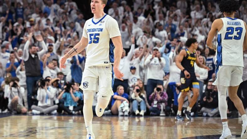 Mar 2, 2024; Omaha, Nebraska, USA; Creighton Bluejays guard Baylor Scheierman (55) celebrates a three point basket against the Marquette Golden Eagles in the second half at CHI Health Center Omaha. Mandatory Credit: Steven Branscombe-USA TODAY Sports