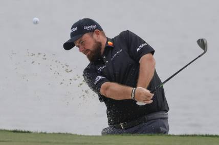 Mar 2, 2024; Palm Beach Gardens, Florida, USA;  Shane Lowry hits from the bunker onto the 18th green during the third round of the Cognizant Classic in The Palm Beaches golf tournament. Mandatory Credit: Reinhold Matay-USA TODAY Sports
