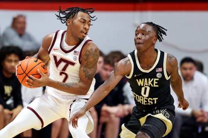 Mar 2, 2024; Blacksburg, Virginia, USA; Virginia Tech Hokies guard MJ Collins (2) handles the ball against Wake Forest Demon Deacons guard Kevin Miller (0) during the first half at Cassell Coliseum. Mandatory Credit: Peter Casey-USA TODAY Sports