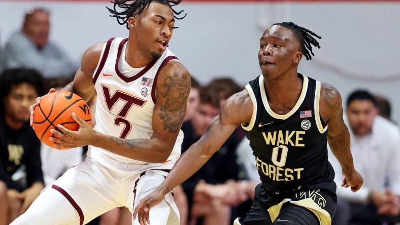 Mar 2, 2024; Blacksburg, Virginia, USA; Virginia Tech Hokies guard MJ Collins (2) handles the ball against Wake Forest Demon Deacons guard Kevin Miller (0) during the first half at Cassell Coliseum. Mandatory Credit: Peter Casey-USA TODAY Sports