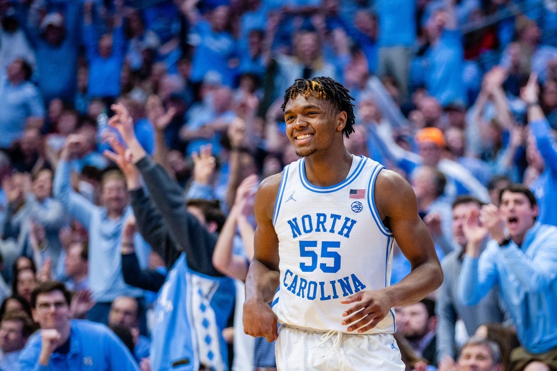 Mar 2, 2024; Chapel Hill, North Carolina, USA; North Carolina Tar Heels forward Harrison Ingram (55) celebrates after a three point basket against the North Carolina State Wolfpack during the second half at Dean E. Smith Center. Mandatory Credit: Scott Kinser-USA TODAY Sports