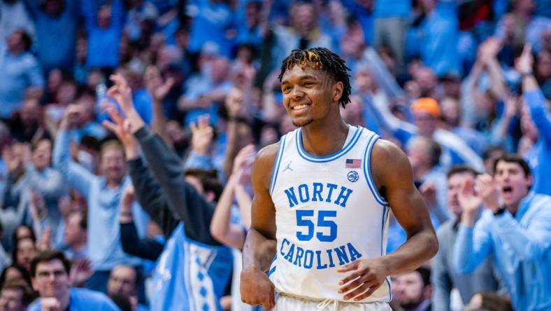 Mar 2, 2024; Chapel Hill, North Carolina, USA; North Carolina Tar Heels forward Harrison Ingram (55) celebrates after a three point basket against the North Carolina State Wolfpack during the second half at Dean E. Smith Center. Mandatory Credit: Scott Kinser-USA TODAY Sports