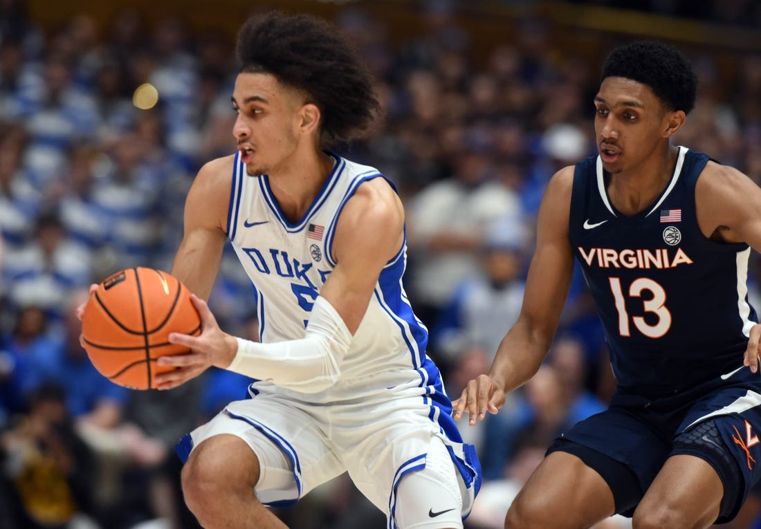 Mar 2, 2024; Durham, North Carolina, USA;  Duke Blue Devils guard Tyrese Proctor (5) tracks down a loose ball in front of Virginia Cavaliers guard Ryan Dunn (13) during the first half at Cameron Indoor Stadium. Mandatory Credit: Rob Kinnan-USA TODAY Sports