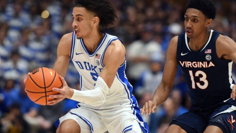 Mar 2, 2024; Durham, North Carolina, USA;  Duke Blue Devils guard Tyrese Proctor (5) tracks down a loose ball in front of Virginia Cavaliers guard Ryan Dunn (13) during the first half at Cameron Indoor Stadium. Mandatory Credit: Rob Kinnan-USA TODAY Sports