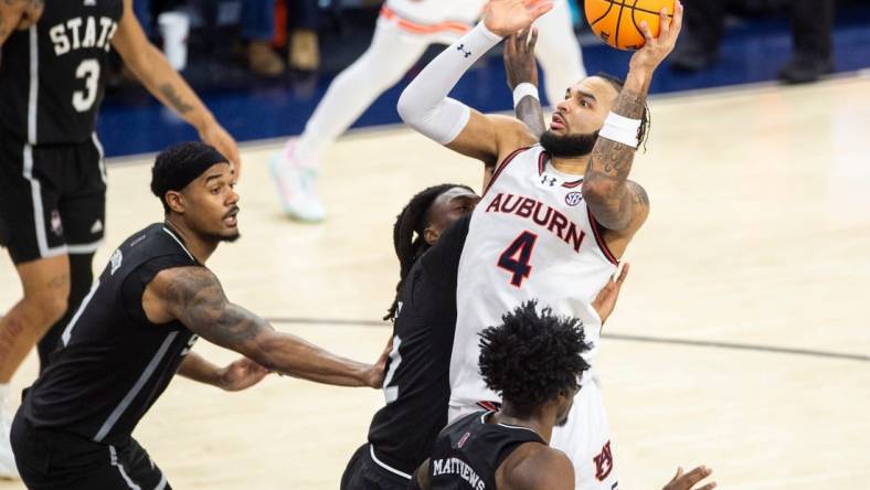 Auburn Tigers forward Johni Broome (4) goes up for a layup as Auburn Tigers take on Mississippi State Bulldogs at Neville Arena in Auburn, Ala., on Saturday, March 2, 2024. Auburn Tigers defeated Mississippi State Bulldogs 78-63.