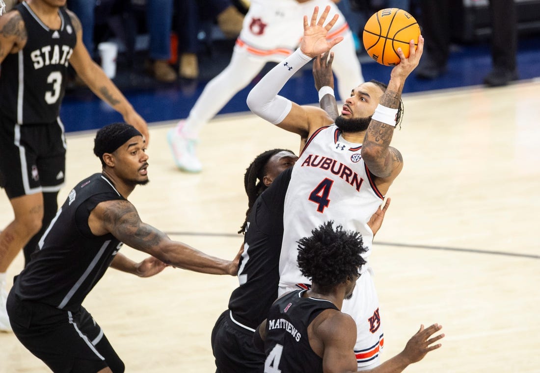 Auburn Tigers forward Johni Broome (4) goes up for a layup as Auburn Tigers take on Mississippi State Bulldogs at Neville Arena in Auburn, Ala., on Saturday, March 2, 2024. Auburn Tigers defeated Mississippi State Bulldogs 78-63.