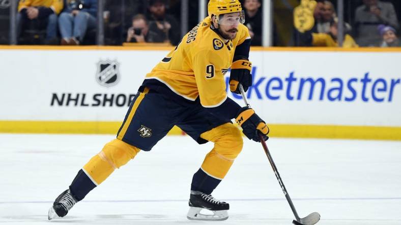 Mar 2, 2024; Nashville, Tennessee, USA; Nashville Predators left wing Filip Forsberg (9) skates with the puck during the first period against the Colorado Avalanche at Bridgestone Arena. Mandatory Credit: Christopher Hanewinckel-USA TODAY Sports