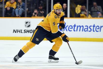 Mar 2, 2024; Nashville, Tennessee, USA; Nashville Predators left wing Filip Forsberg (9) skates with the puck during the first period against the Colorado Avalanche at Bridgestone Arena. Mandatory Credit: Christopher Hanewinckel-USA TODAY Sports