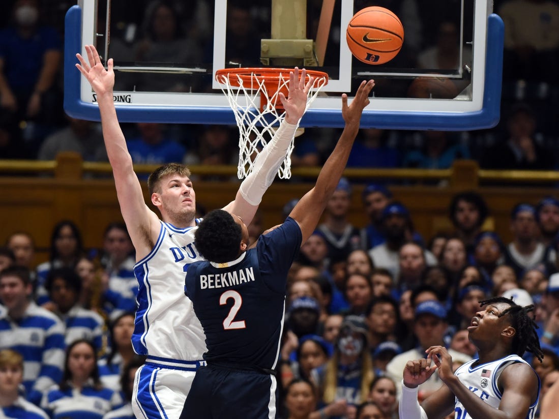 Mar 2, 2024; Durham, North Carolina, USA; Virginia Cavaliers guard Reece Beekman (2) shoots over Duke Blue Devils center Kyle Filipowski (30) during the second half at Cameron Indoor Stadium. Mandatory Credit: Rob Kinnan-USA TODAY Sports