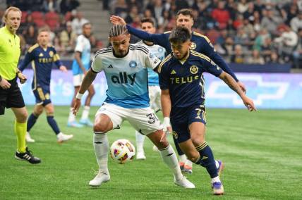 Mar 2, 2024; Vancouver, British Columbia, CAN; Charlotte FC defender Jere Uronen (3) and Vancouver Whitecaps FC midfielder Ryan Raposo (7) race after the ball during the first half at BC Place. Mandatory Credit: Anne-Marie Sorvin-USA TODAY Sports