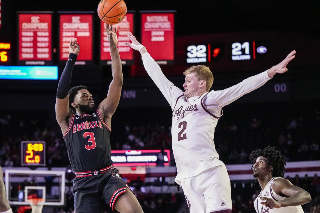 Mar 2, 2024; Athens, Georgia, USA; Georgia Bulldogs guard Noah Thomasson (3) shoots over Texas A&M Aggies guard Hayden Hefner (2) during the first half at Stegeman Coliseum. Mandatory Credit: Dale Zanine-USA TODAY Sports