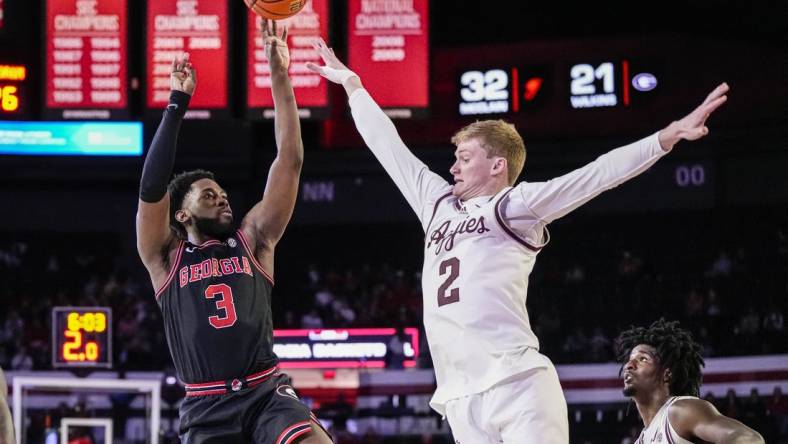 Mar 2, 2024; Athens, Georgia, USA; Georgia Bulldogs guard Noah Thomasson (3) shoots over Texas A&M Aggies guard Hayden Hefner (2) during the first half at Stegeman Coliseum. Mandatory Credit: Dale Zanine-USA TODAY Sports