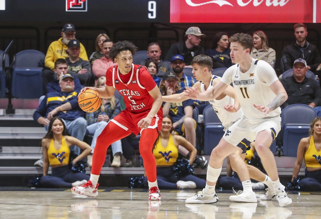 Mar 2, 2024; Morgantown, West Virginia, USA; Texas Tech Red Raiders guard Darrion Williams (5) backs down West Virginia Mountaineers guard Kerr Kriisa (3) during the second half at WVU Coliseum. Mandatory Credit: Ben Queen-USA TODAY Sports