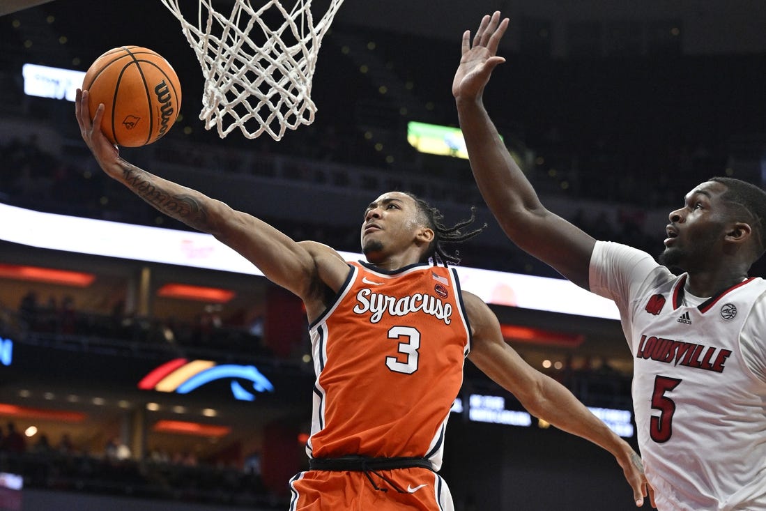 Mar 2, 2024; Louisville, Kentucky, USA; Syracuse Orange guard Judah Mintz (3) shoots against Louisville Cardinals forward Brandon Huntley-Hatfield (5) during the first half at KFC Yum! Center. Mandatory Credit: Jamie Rhodes-USA TODAY Sports