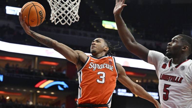 Mar 2, 2024; Louisville, Kentucky, USA; Syracuse Orange guard Judah Mintz (3) shoots against Louisville Cardinals forward Brandon Huntley-Hatfield (5) during the first half at KFC Yum! Center. Mandatory Credit: Jamie Rhodes-USA TODAY Sports