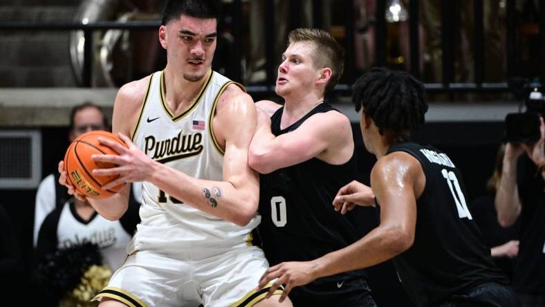 Mar 2, 2024; West Lafayette, Indiana, USA; Purdue Boilermakers center Zach Edey (15) pushes against Michigan State Spartans forward Jaxon Kohler (0) during the first half at Mackey Arena. Mandatory Credit: Marc Lebryk-USA TODAY Sports