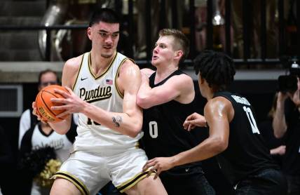 Mar 2, 2024; West Lafayette, Indiana, USA; Purdue Boilermakers center Zach Edey (15) pushes against Michigan State Spartans forward Jaxon Kohler (0) during the first half at Mackey Arena. Mandatory Credit: Marc Lebryk-USA TODAY Sports