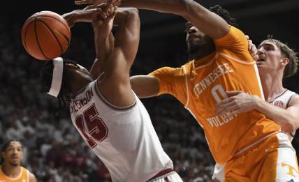 Mar 2, 2024; Tuscaloosa, Alabama, USA;  Alabama forward Jarin Stevenson (15) and Tennessee forward Jonas Aiddo (0) fight for a rebound that gets knocked out of bounds at Coleman Coliseum. Mandatory Credit: Gary Cosby Jr.-USA TODAY Sports