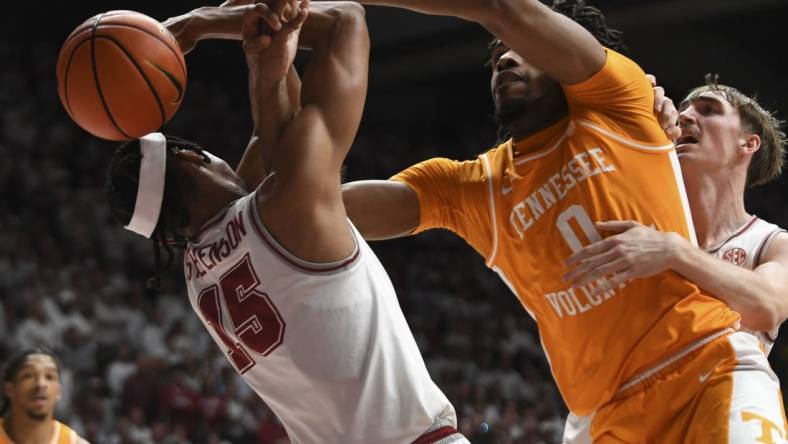 Mar 2, 2024; Tuscaloosa, Alabama, USA;  Alabama forward Jarin Stevenson (15) and Tennessee forward Jonas Aiddo (0) fight for a rebound that gets knocked out of bounds at Coleman Coliseum. Mandatory Credit: Gary Cosby Jr.-USA TODAY Sports