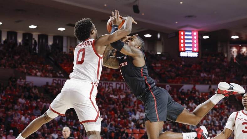 Mar 2, 2024; Norman, Oklahoma, USA; Houston Cougars guard Jamal Shead (1) and Oklahoma Sooners guard Le'Tre Darthard (0) reach for a loose ball during the first half at Lloyd Noble Center. Mandatory Credit: Alonzo Adams-USA TODAY Sports