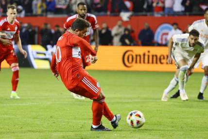 Mar 2, 2024; Chicago, Illinois, USA; Chicago Fire FC midfielder Xherdan Shaqiri (10) kicks and scores a goal against the FC Cincinnati in the first half at Soldier Field. Mandatory Credit: Mike Dinovo-USA TODAY Sports