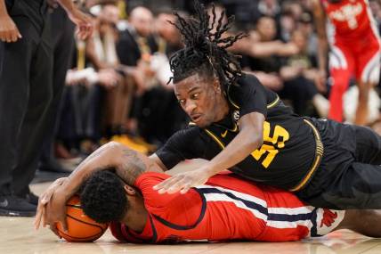 Mar 2, 2024; Columbia, Missouri, USA; Mississippi Rebels guard Brandon Murray (0) and Missouri Tigers guard Sean East II (55) scramble for a loose ball during the first half at Mizzou Arena. Mandatory Credit: Denny Medley-USA TODAY Sports