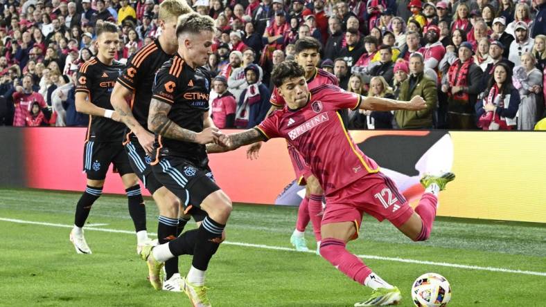 Mar 2, 2024; St. Louis, Missouri, USA;  St. Louis CITY SC midfielder Celio Pompeu (12) controls the ball against New York City FC defender Mitja Ilenic (35) in the first half at CITYPARK. Mandatory Credit: Jeff Le-USA TODAY Sports