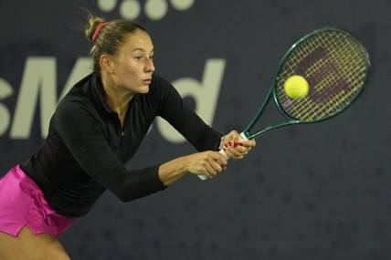 Mar 2, 2024; San Diego, CA, USA; Marta Kostyuk of Ukraine hits a backhand against Jessica Pegula of the United States (not pictured) during the second set of the semifinals of the San Diego Open at Barnes Tennis Center. Mandatory Credit: Ray Acevedo-USA TODAY Sports