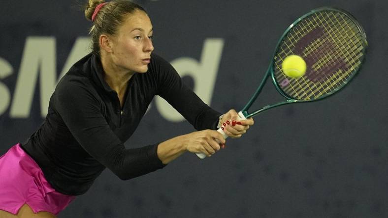 Mar 2, 2024; San Diego, CA, USA; Marta Kostyuk of Ukraine hits a backhand against Jessica Pegula of the United States (not pictured) during the second set of the semifinals of the San Diego Open at Barnes Tennis Center. Mandatory Credit: Ray Acevedo-USA TODAY Sports