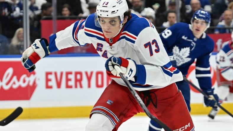 Mar 2, 2024; Toronto, Ontario, CAN;  New York Rangers forward Matt Rempe (73) pursues the play against the Toronto Maple Leafs in the third period at Scotiabank Arena. Mandatory Credit: Dan Hamilton-USA TODAY Sports