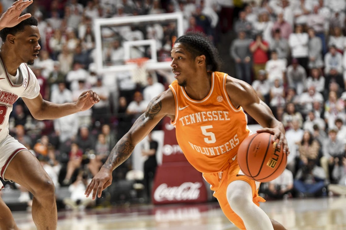 Mar 2, 2024; Tuscaloosa, Alabama, USA;  Tennessee guard Zakai Zeigler (5) drives against Alabama guard Rylan Griffen (3) at Coleman Coliseum. Mandatory Credit: Gary Cosby Jr.-USA TODAY Sports