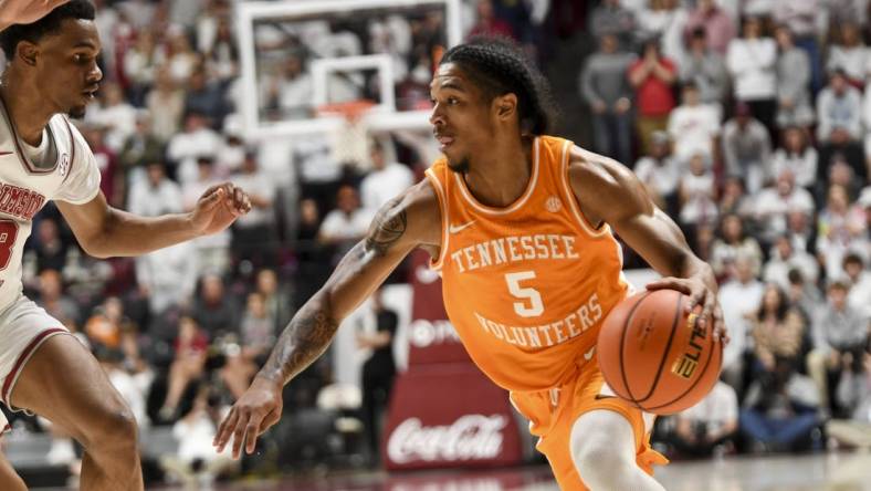 Mar 2, 2024; Tuscaloosa, Alabama, USA;  Tennessee guard Zakai Zeigler (5) drives against Alabama guard Rylan Griffen (3) at Coleman Coliseum. Mandatory Credit: Gary Cosby Jr.-USA TODAY Sports