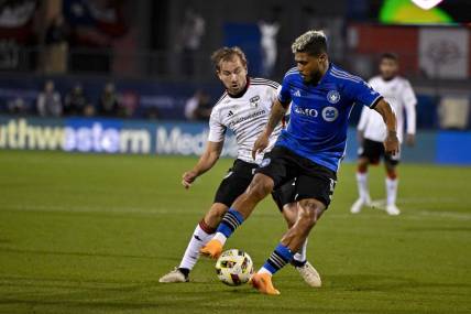 Mar 2, 2024; Frisco, Texas, USA; FC Dallas midfielder Paxton Pomykal (19) and CF Montreal forward Josef Martinez (17) battle for control of the ball during the second half at Toyota Stadium. Mandatory Credit: Jerome Miron-USA TODAY Sports
