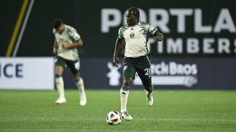 Mar 2, 2024; Portland, Oregon, USA; Portland Timbers midfielder Diego Chara (21) controls the ball during the second half against D.C. United at Providence Park. Mandatory Credit: Troy Wayrynen-USA TODAY Sports