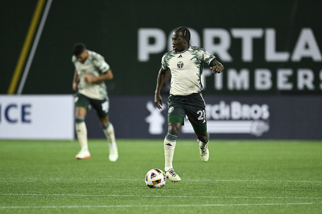 Mar 2, 2024; Portland, Oregon, USA; Portland Timbers midfielder Diego Chara (21) controls the ball during the second half against D.C. United at Providence Park. Mandatory Credit: Troy Wayrynen-USA TODAY Sports