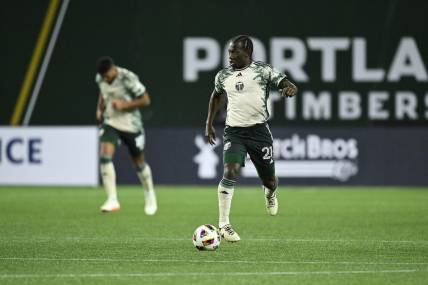 Mar 2, 2024; Portland, Oregon, USA; Portland Timbers midfielder Diego Chara (21) controls the ball during the second half against D.C. United at Providence Park. Mandatory Credit: Troy Wayrynen-USA TODAY Sports