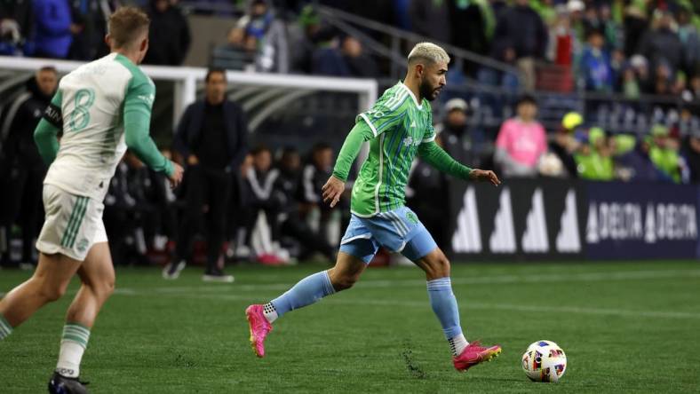 Mar 2, 2024; Seattle, Washington, USA; Seattle Sounders FC defender Alex Roldan (16) controls the ball against Austin FC midfielder Alex Ring (8) during the second half at Lumen Field. Mandatory Credit: Joe Nicholson-USA TODAY Sports