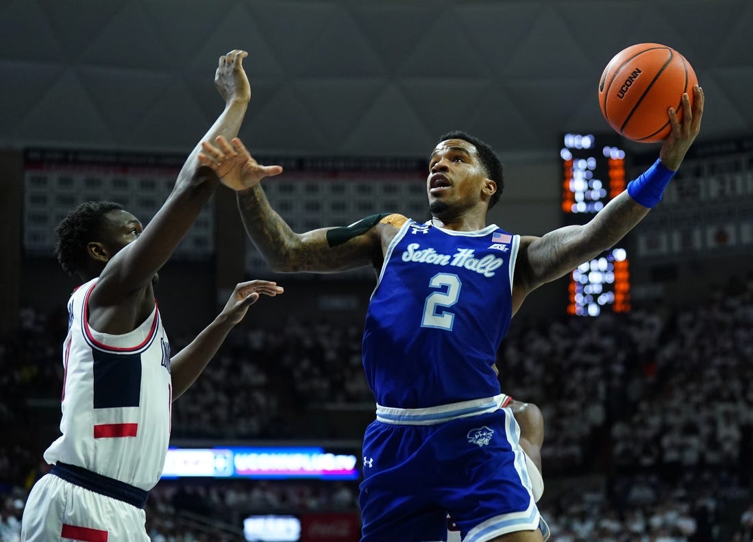 Mar 3, 2024; Storrs, Connecticut, USA; Seton Hall Pirates guard Al-Amir Dawes (2) shoots against UConn Huskies guard Hassan Diarra (10) in the first half at Harry A. Gampel Pavilion. Mandatory Credit: David Butler II-USA TODAY Sports