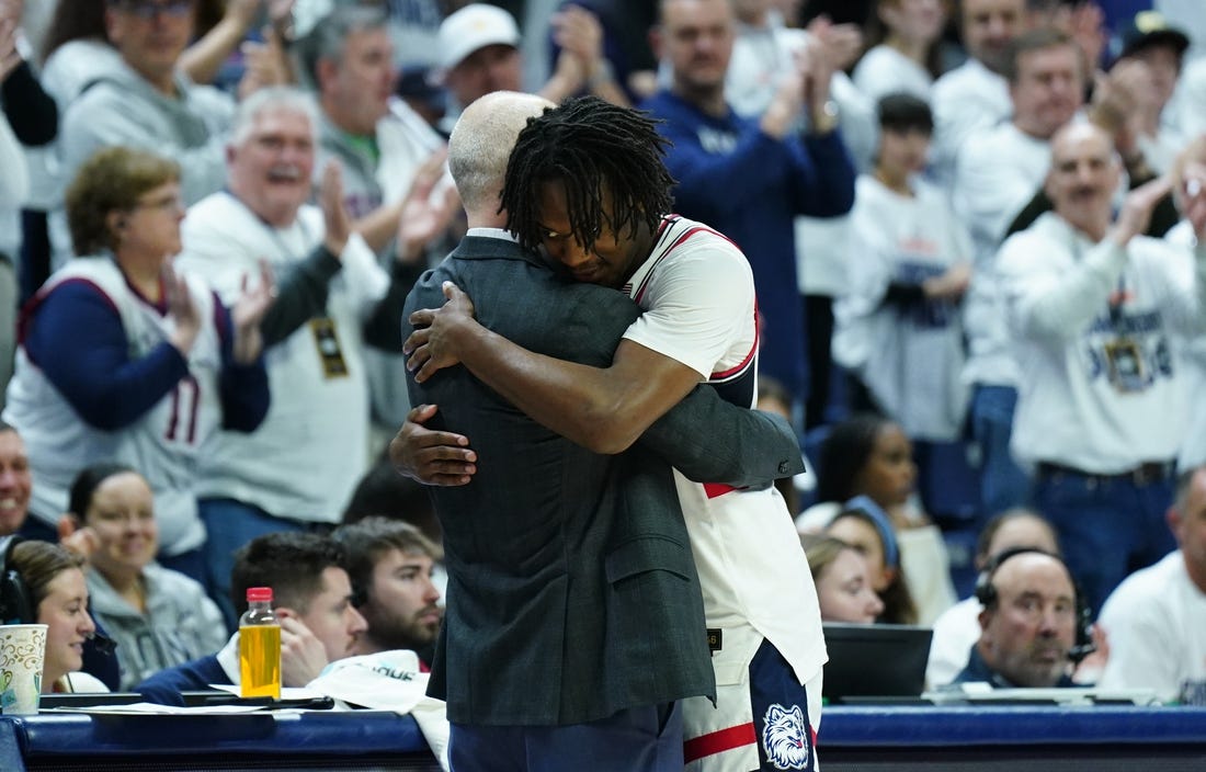 Mar 3, 2024; Storrs, Connecticut, USA; UConn Huskies head coach Dan Hurley hugs guard Tristen Newton (2) as he comes off the court during his final home game as they take on the Seton Hall Pirates at Harry A. Gampel Pavilion. Mandatory Credit: David Butler II-USA TODAY Sports