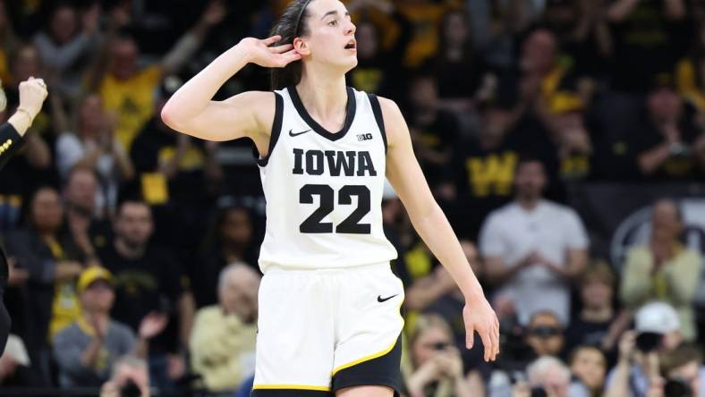 Mar 3, 2024; Iowa City, Iowa, USA; Iowa Hawkeyes guard Caitlin Clark (22) celebrates the win over the Ohio State Buckeyes during the second half at Carver-Hawkeye Arena. Mandatory Credit: Reese Strickland-USA TODAY Sports