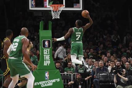 Mar 3, 2024; Boston, Massachusetts, USA;  Boston Celtics guard Jaylen Brown (7) goes in for a dunk during the second half against the Golden State Warriors at TD Garden. Mandatory Credit: Bob DeChiara-USA TODAY Sports